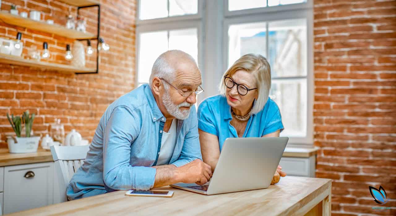 Senior Couple searching for an assisted living facility from their computer