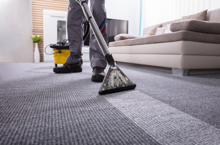 Professional carpet cleaning in Manchester using industrial equipment.