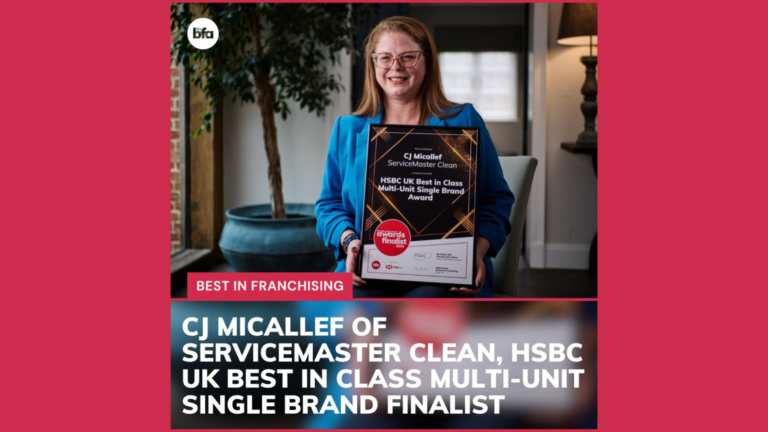 CJ Micallef holding ServiceMaster award at BFA HSBC UK British Franchise Awards 2024.
