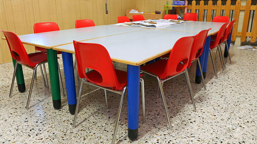Childrens' classroom with colorful chairs and tables