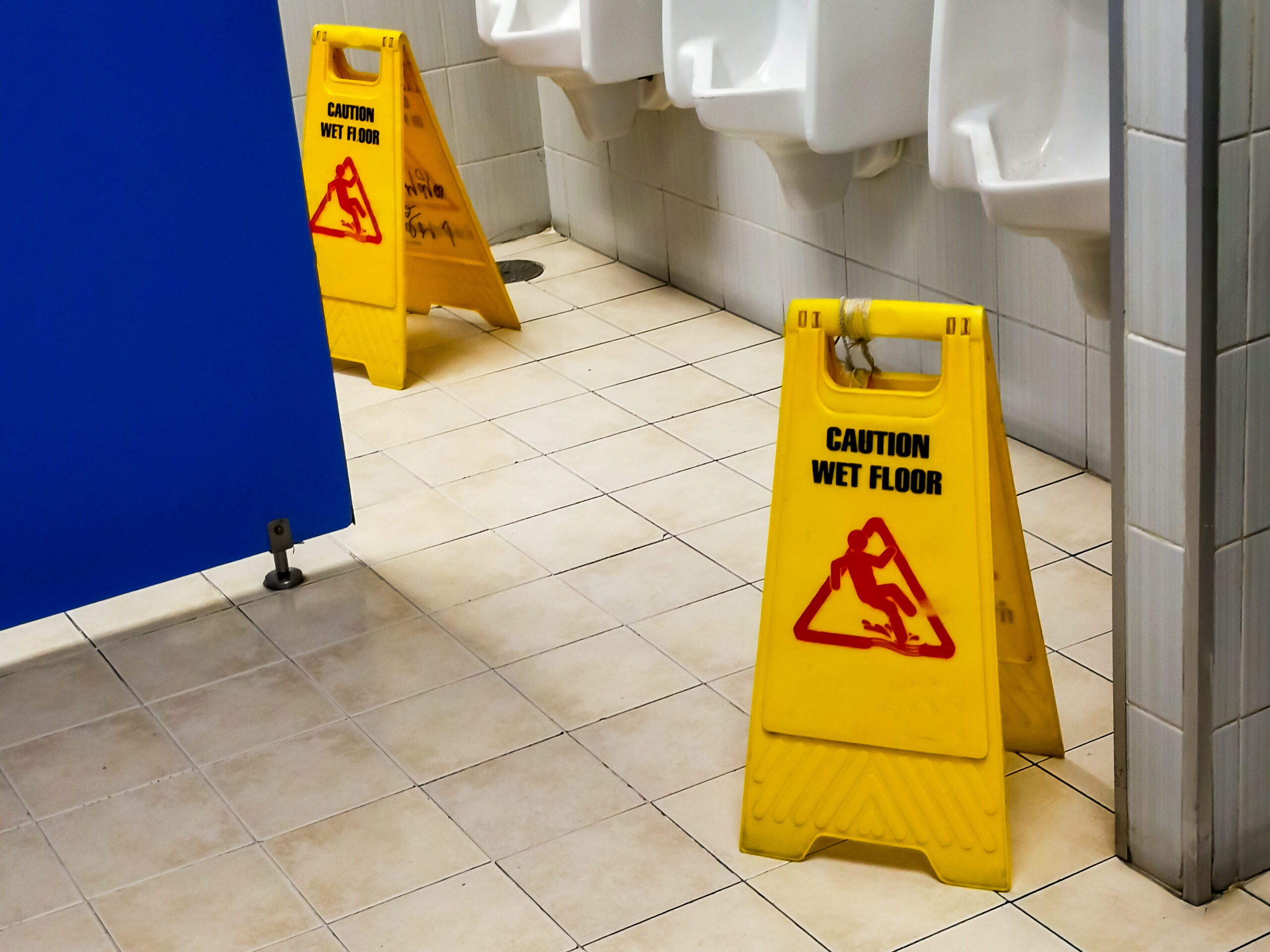 Caution Wet Floor Sign in a public restroom.