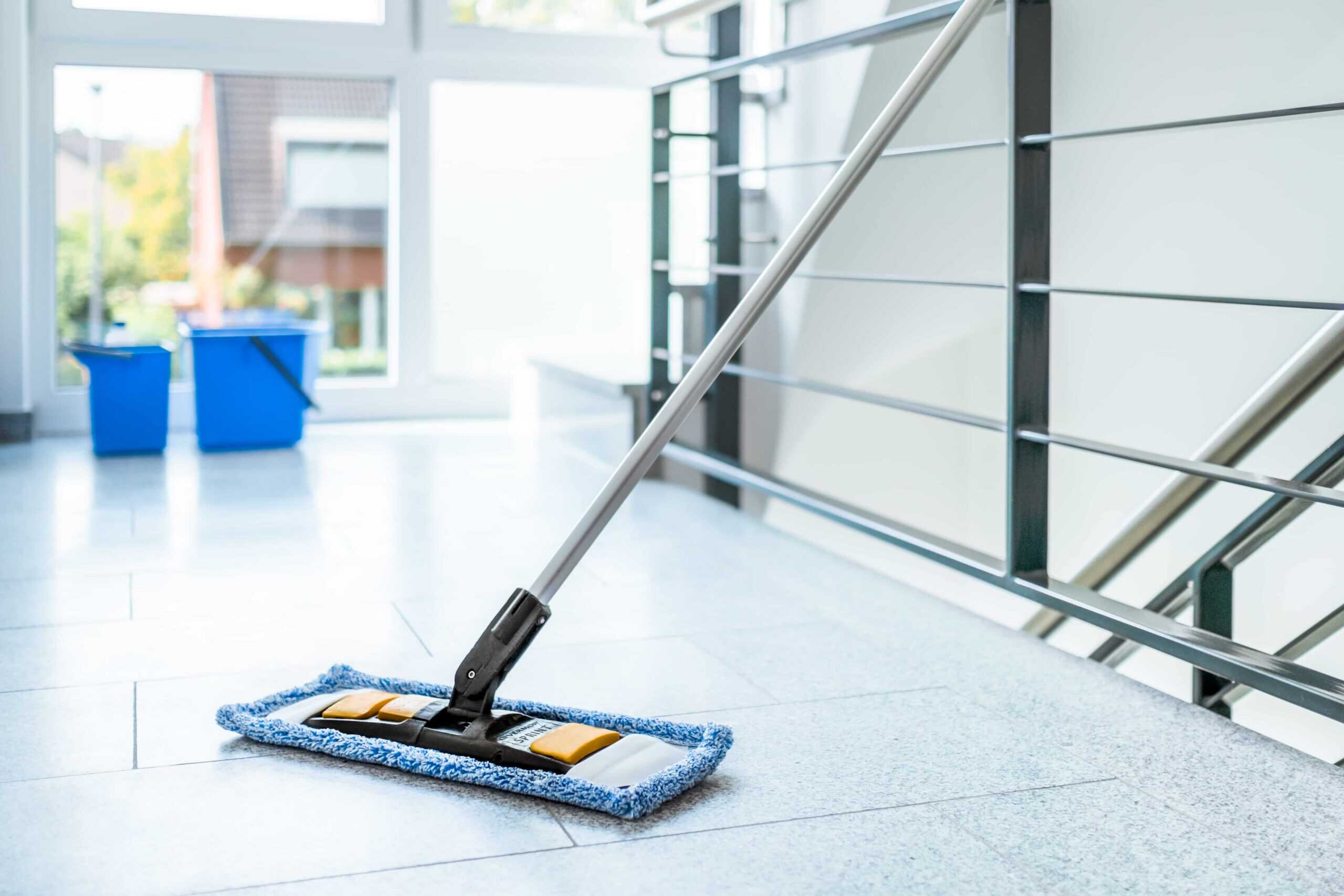 Bright, modern indoor space with floor cleaning equipment, showcasing professional cleaning services.