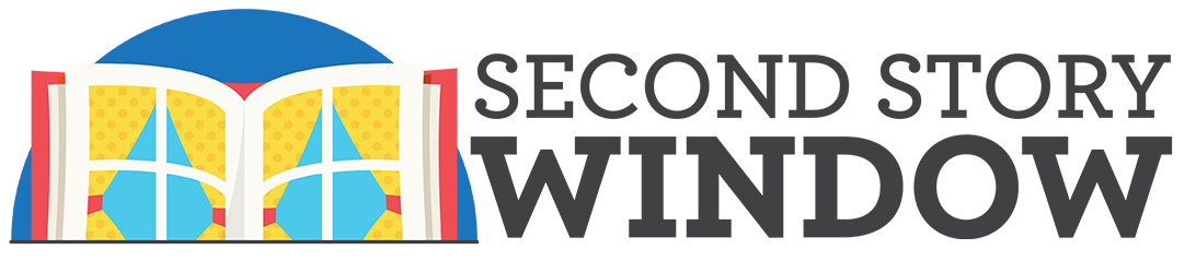 Logo with an open book illustration next to the bold, uppercase text "Second Story Window," perfectly capturing the brand’s identity.