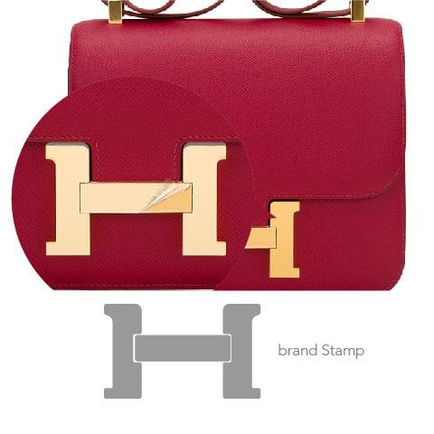 Hermes red handbag with protective stamp film for brand authenticity.