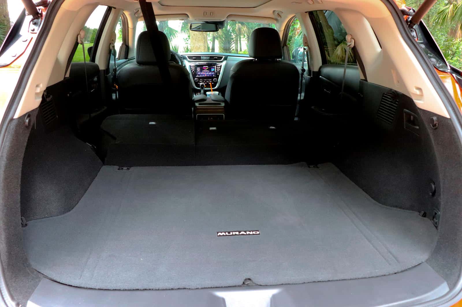 Nissan Murano trunk cargo area with luggage kit installed for protection and organization.