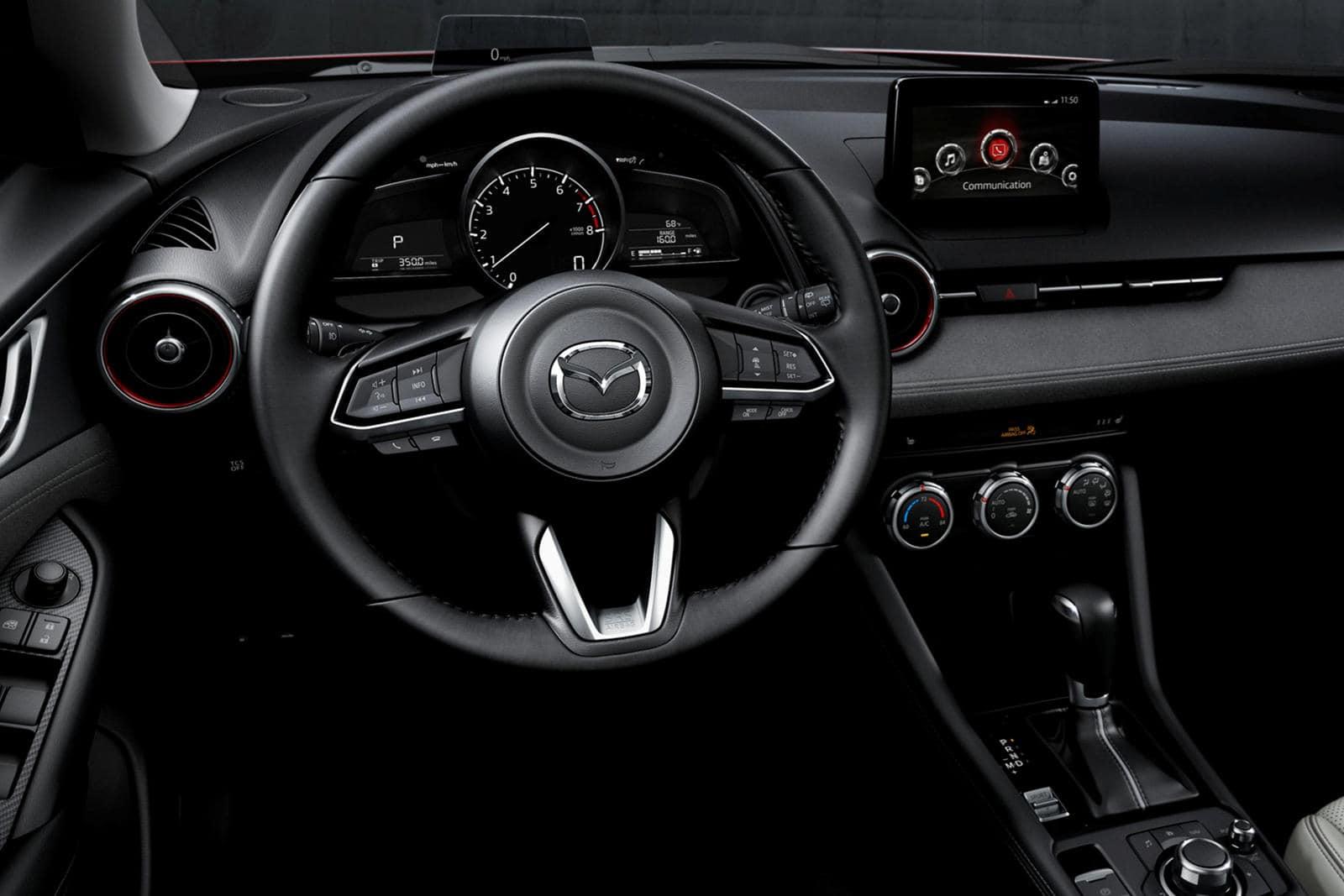 Mazda CX-3 interior dashboard and steering wheel with modern features.