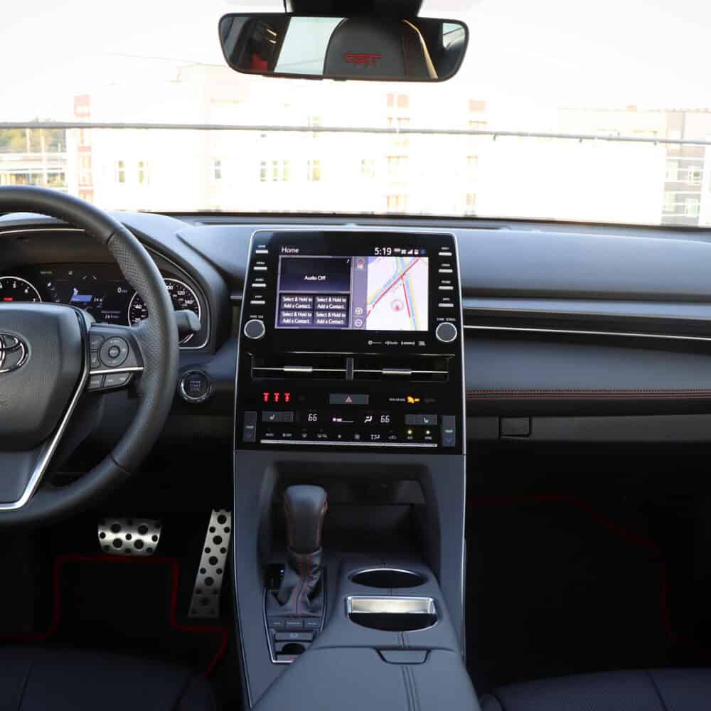 Interior dashboard view of Toyota Avalon with custom interior kit and modern infotainment system.