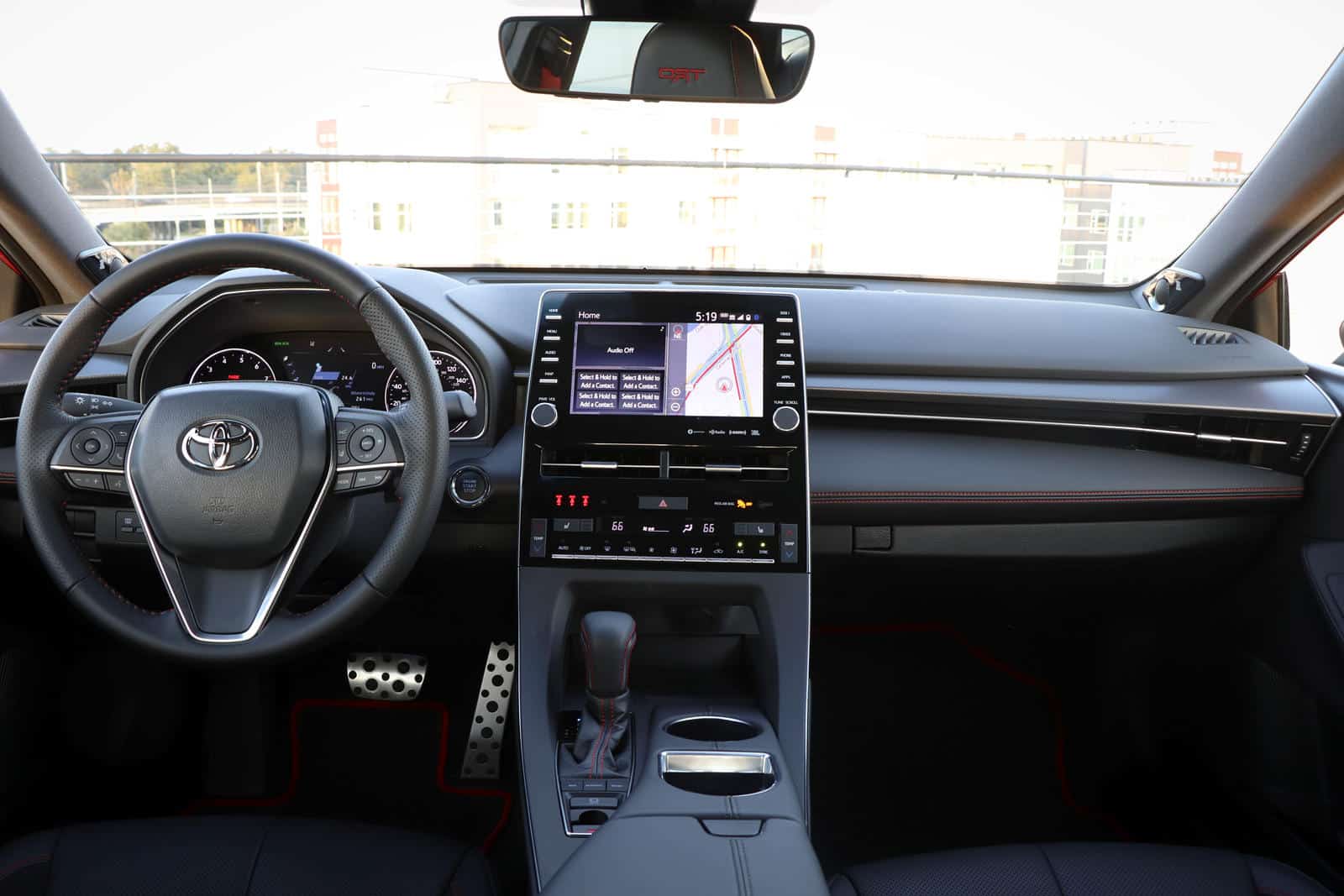 Interior dashboard view of Toyota Avalon with custom interior kit and modern infotainment system.