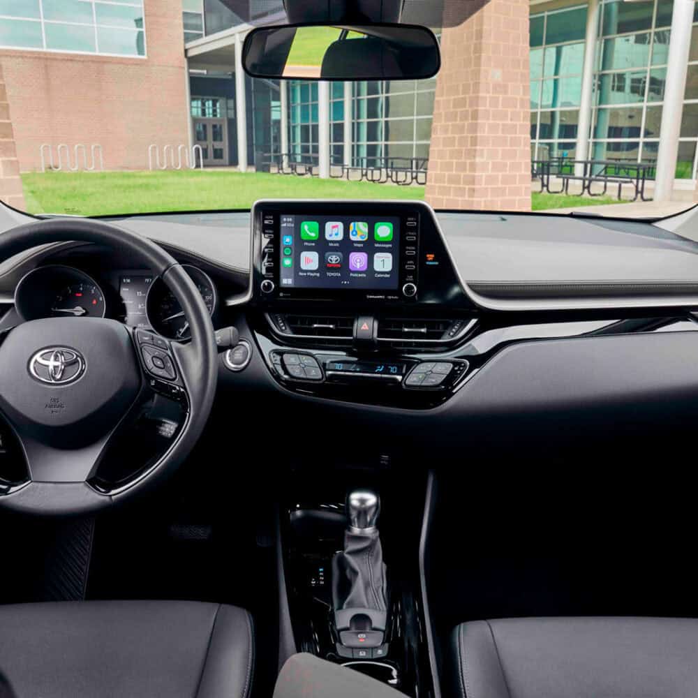 Interior dashboard of Toyota C-HR with custom kit, touchscreen display, and modern design.