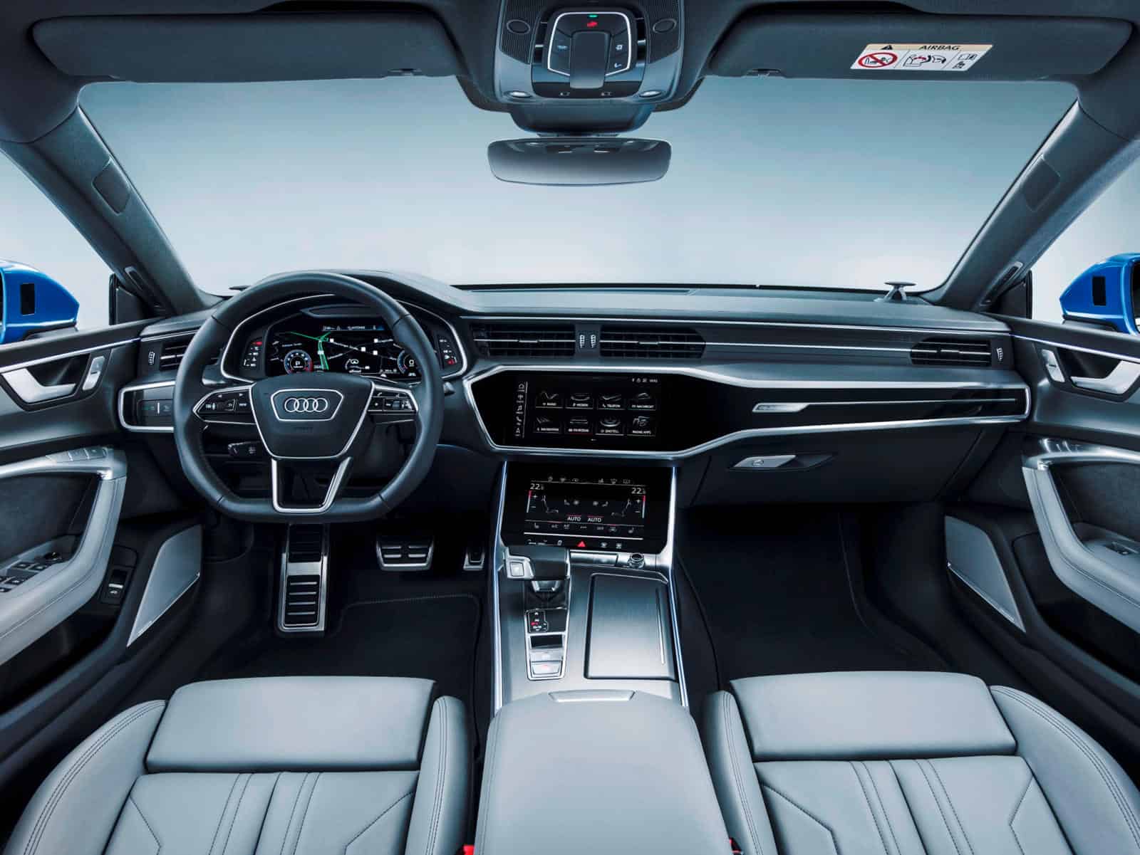 Interior dashboard and steering wheel of Audi A7 with custom interior kit.