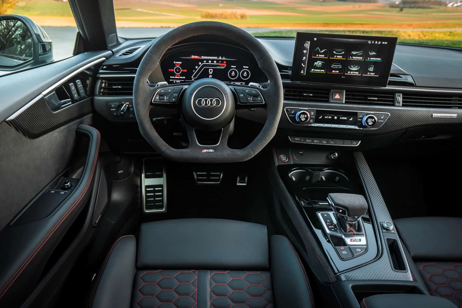 Interior of Audi RS5 with custom interior kit and advanced dashboard display.