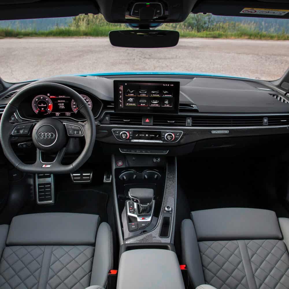 Interior view of an Audi S4 showcasing premium interior kit with modern dashboard and advanced infot.