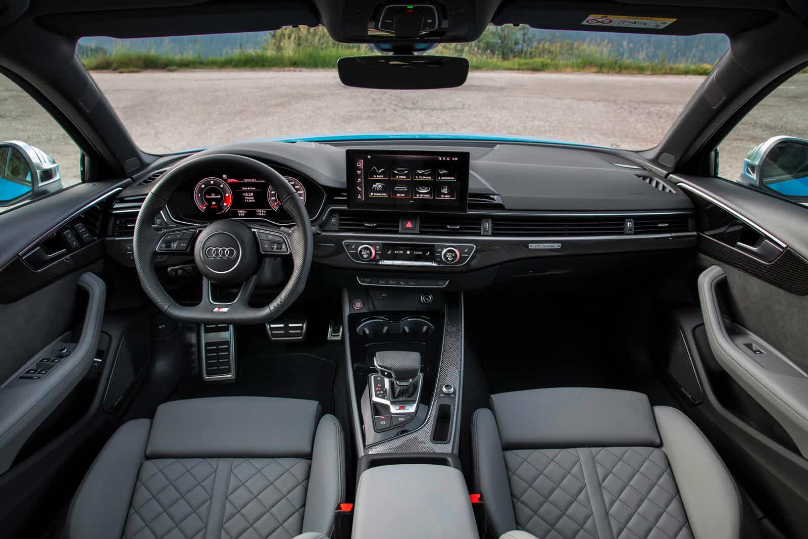 Interior view of an Audi S4 showcasing premium interior kit with modern dashboard and advanced infot.
