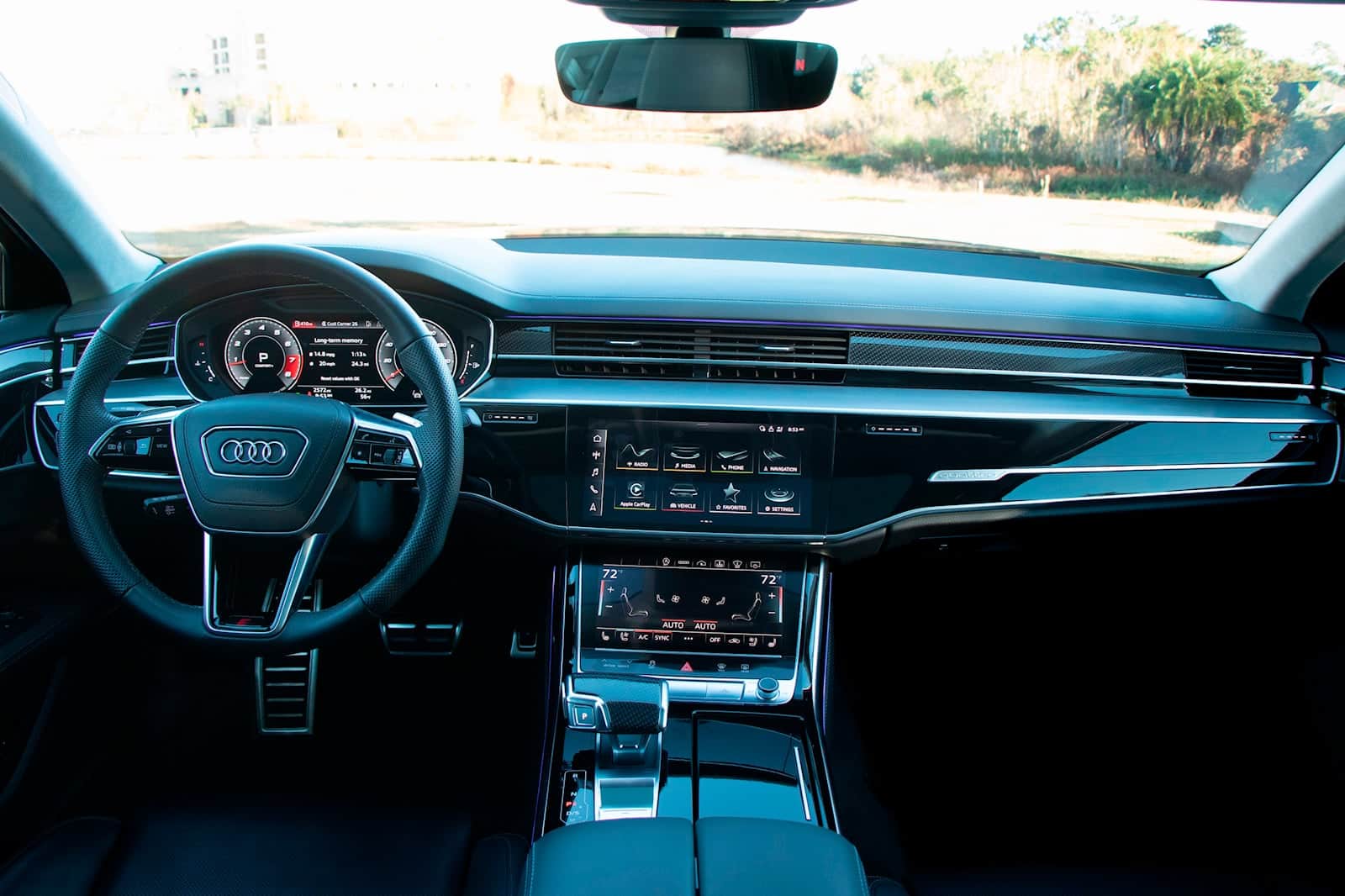 Interior view of Audi S8 showcasing premium dashboard and control features.