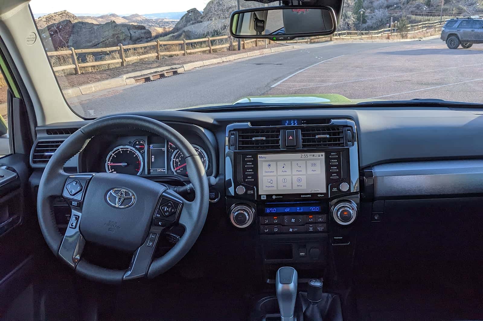 Interior dashboard and steering wheel of Toyota 4Runner with custom interior accessories.