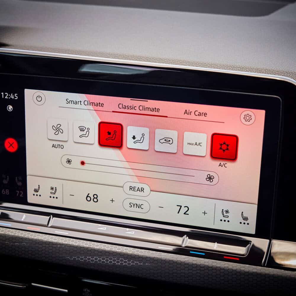 Car dashboard touchscreen with climate control in Volkswagen Golf GTI.
