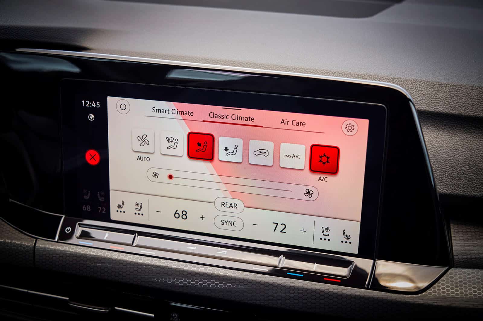 Car dashboard touchscreen with climate control in Volkswagen Golf GTI.