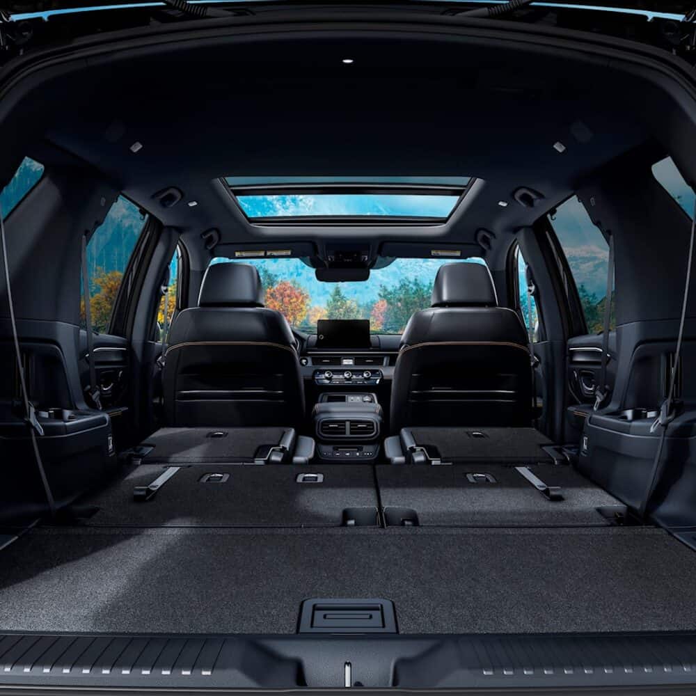 Honda Pilot cargo area with luggage kit for enhanced storage and organization.