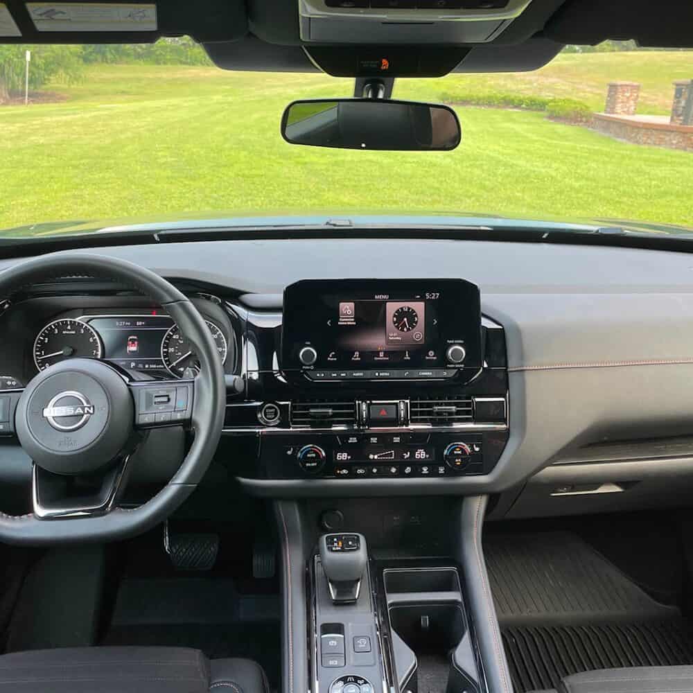 Interior dashboard and control panel of Nissan Pathfinder.