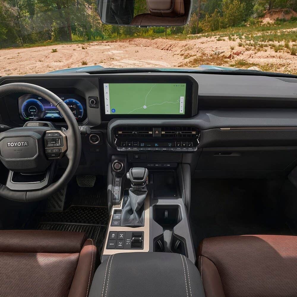 Interior upgrade for Toyota Land Cruiser with custom dashboard and tech features.
