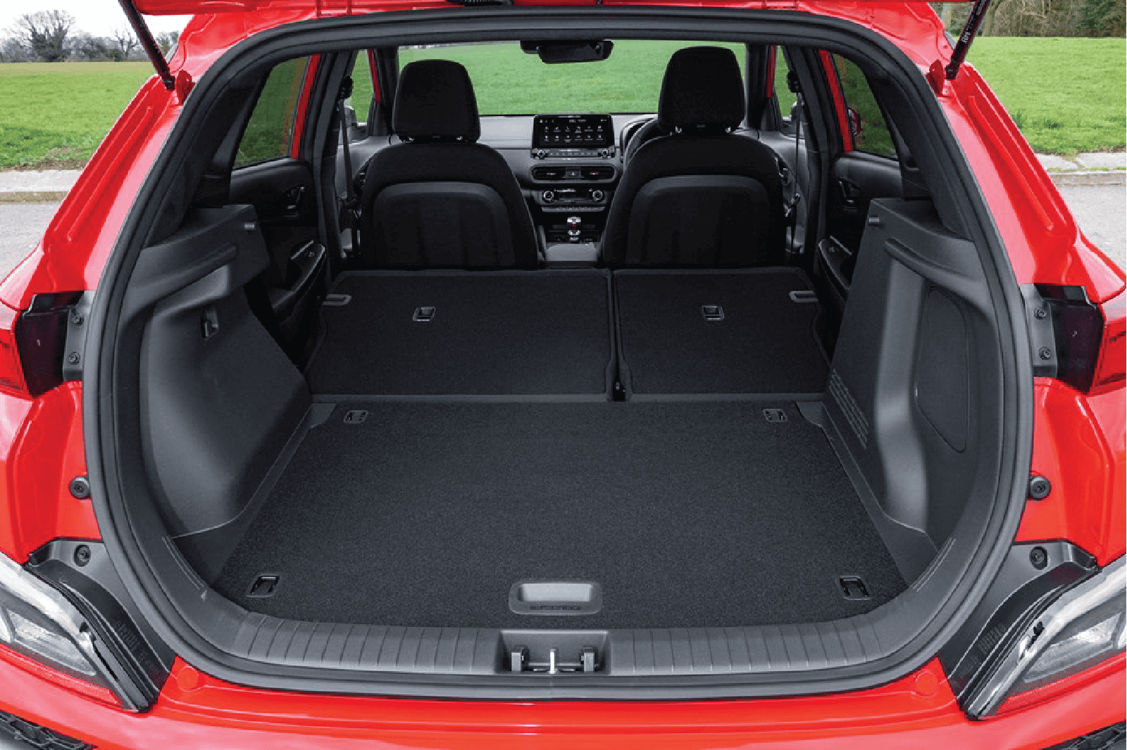 Hyundai Kona trunk cargo area with luggage kit installed, spacious and organized.