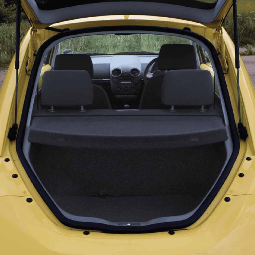 Volkswagen Beetle trunk organizer for luggage and cargo storage.