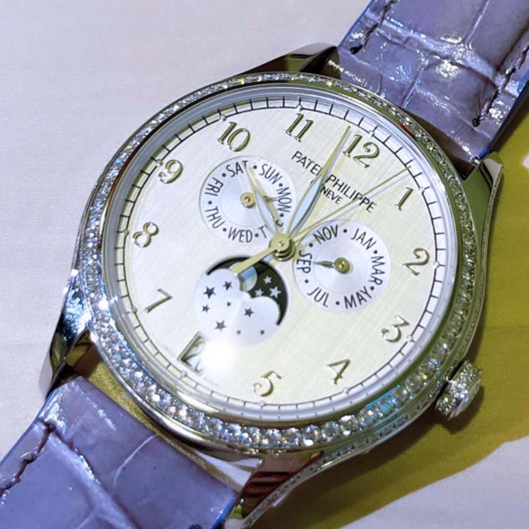 Patek Philippe watch featuring customized glass protection and elegant design.