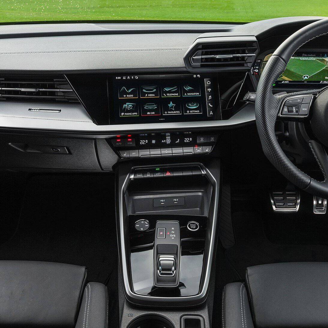 Modern car interior dashboard with touchscreen and gear shift for comfortable driving.