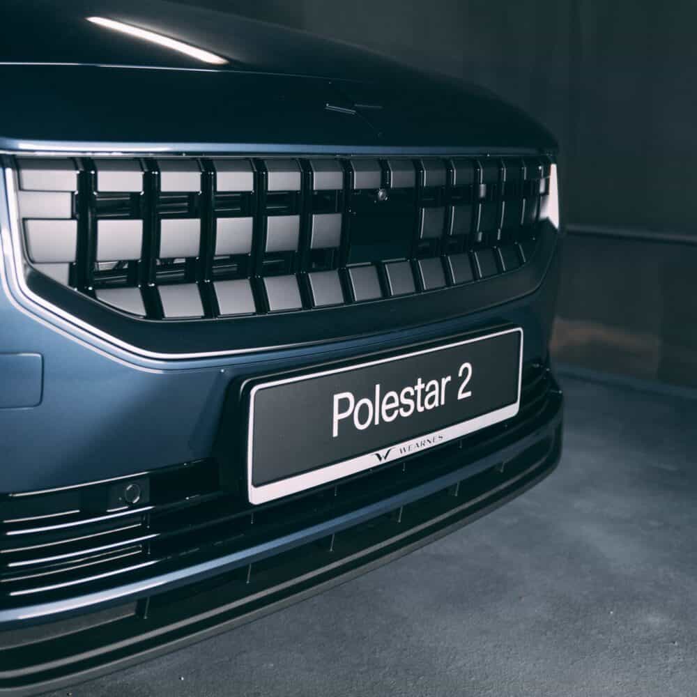 Close-up of Polestar 2 front grille and license plate.