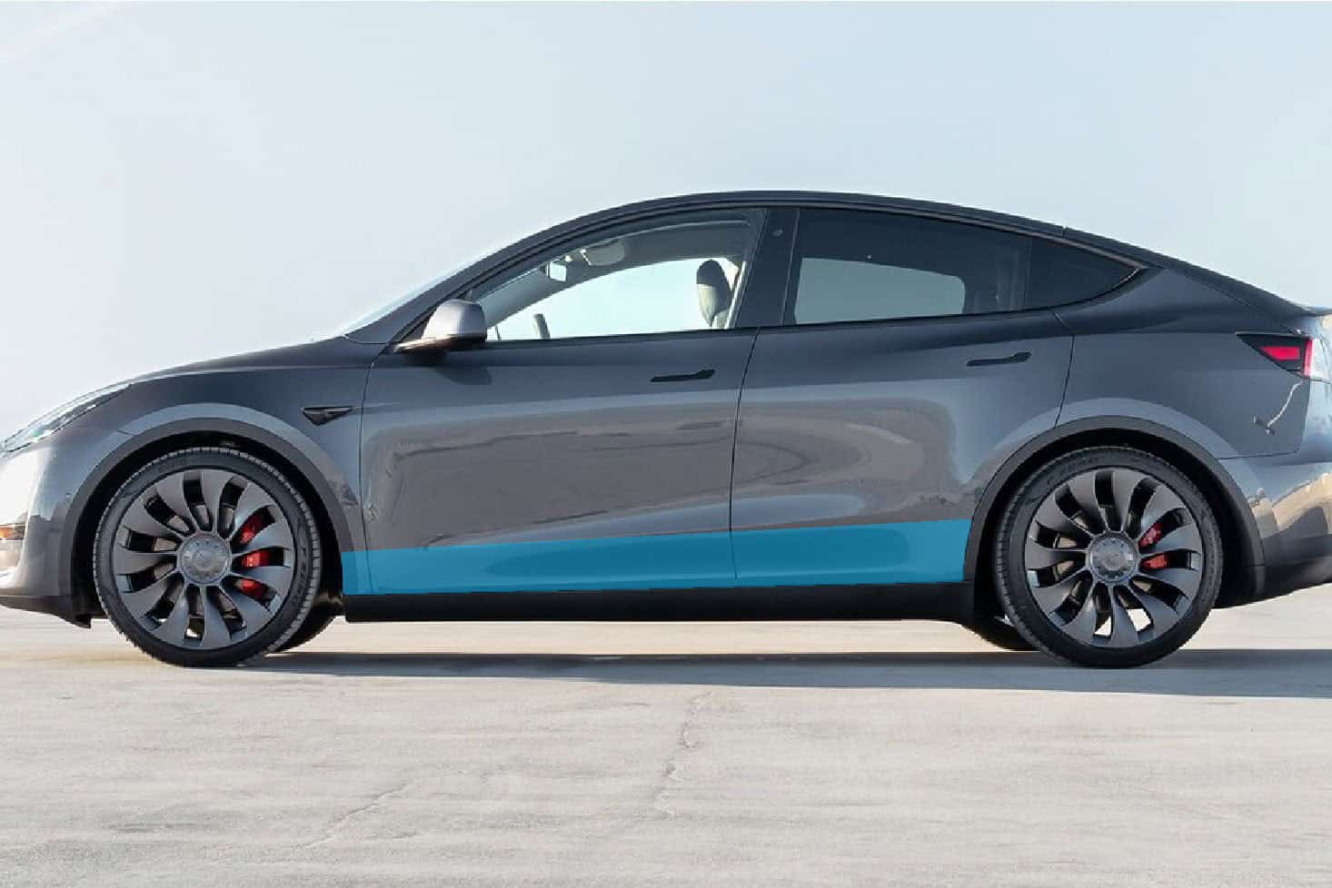 Electric Tesla Model Y with sleek black exterior and modern design.