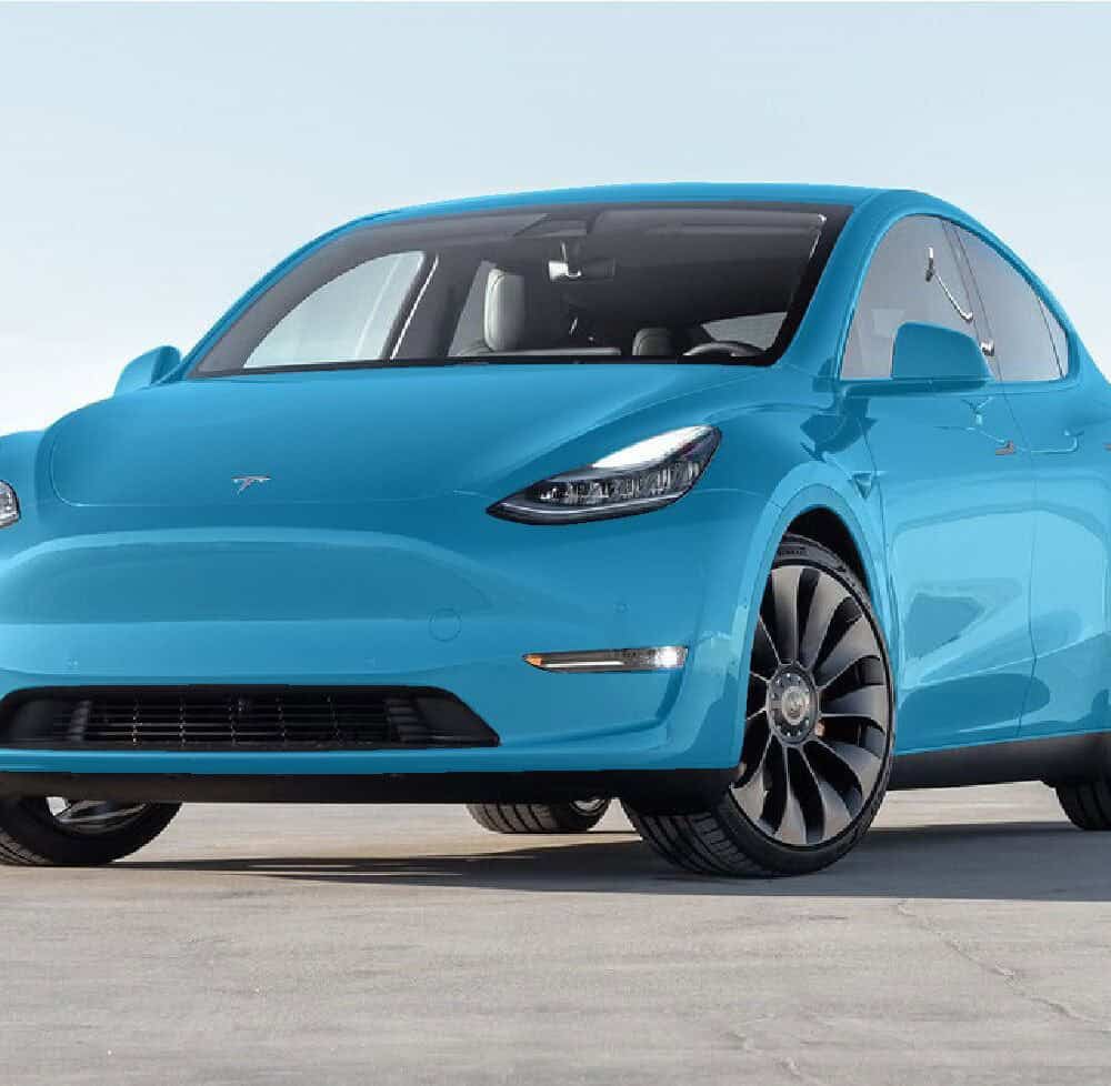 Tesla Model-Y with XPEL full vehicle wrap in vibrant blue.