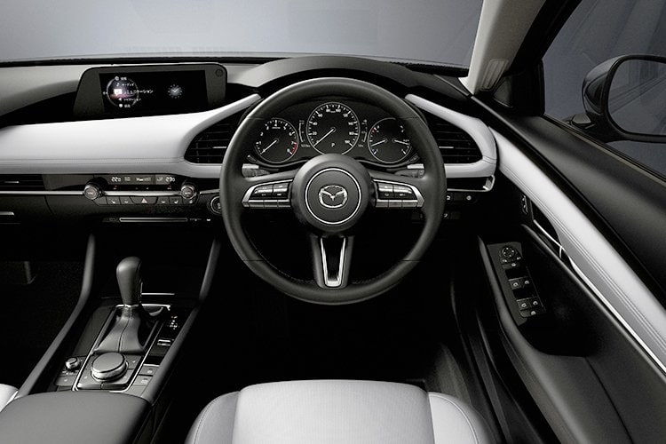 Interior dashboard and steering wheel of Mazda 3 2023 model.