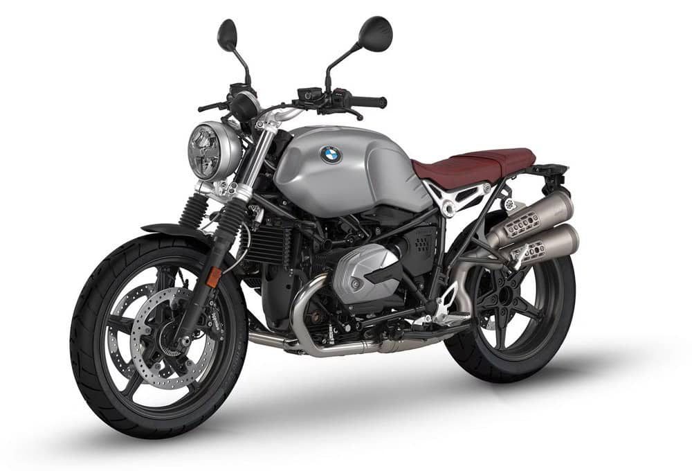 High-quality BMW motorcycle featuring a sleek silver finish, dual exhaust, and comfortable brown sea.