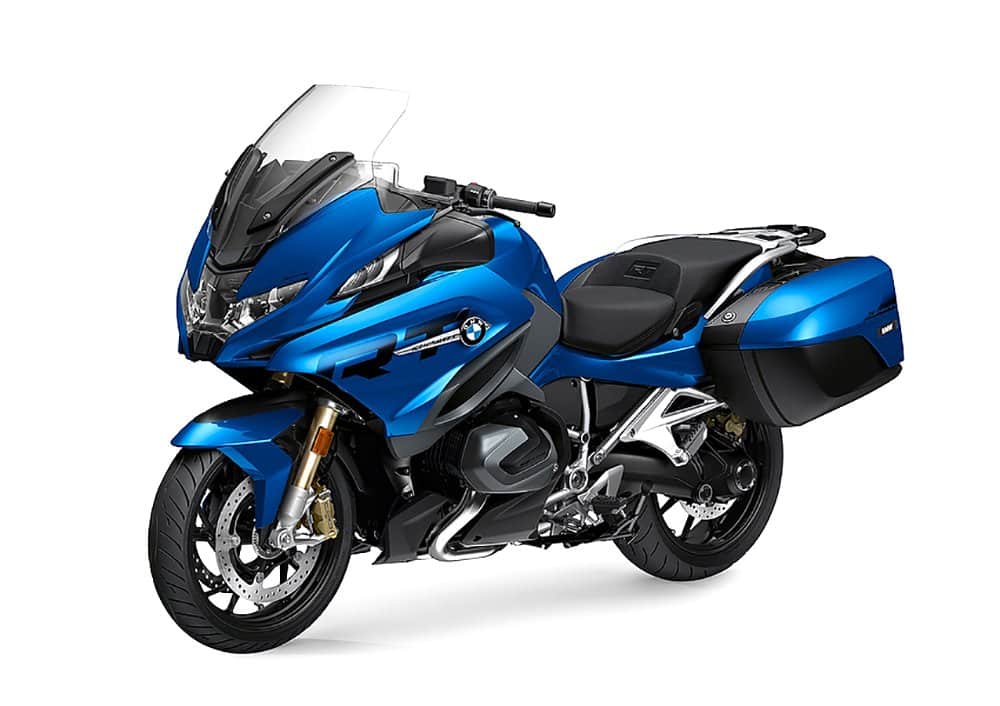 Blue BMW touring motorcycle with side cases, ideal for long-distance travel.