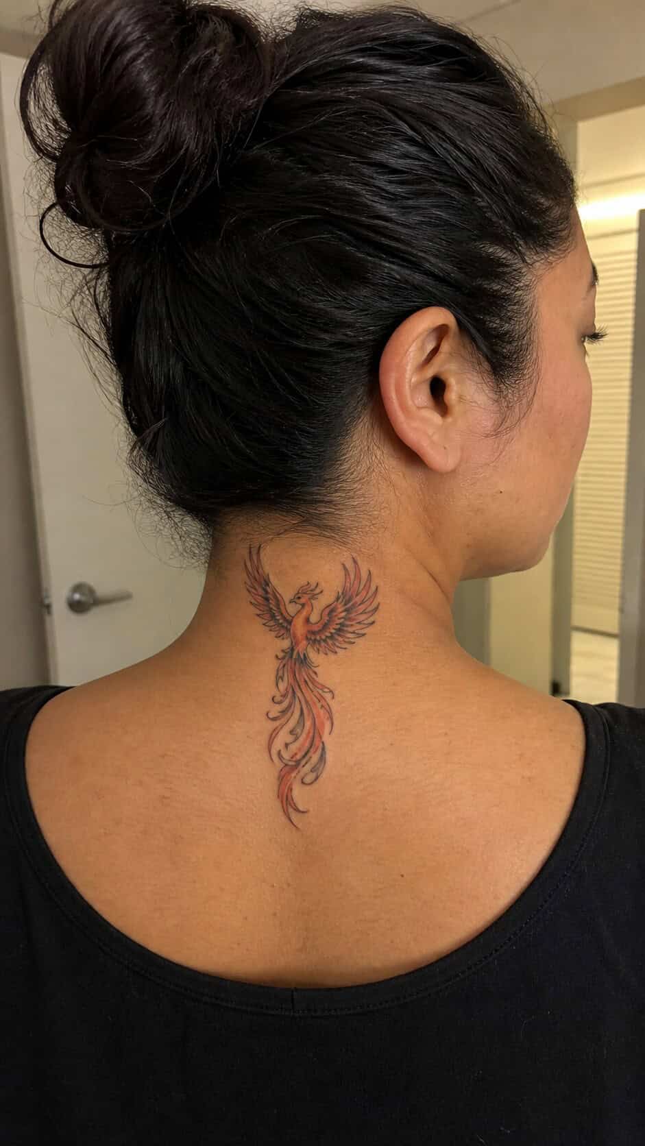 Phoenix Rising neck tattoo idea