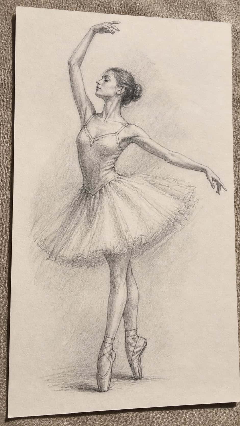 20 Girl Drawing Concepts to Elevate Your Art Game 10 Hand-drawn classic ballet dancer in graphite drawing on textured paper, shown in a gentle oblique desk view that shows paper tooth and — study 3