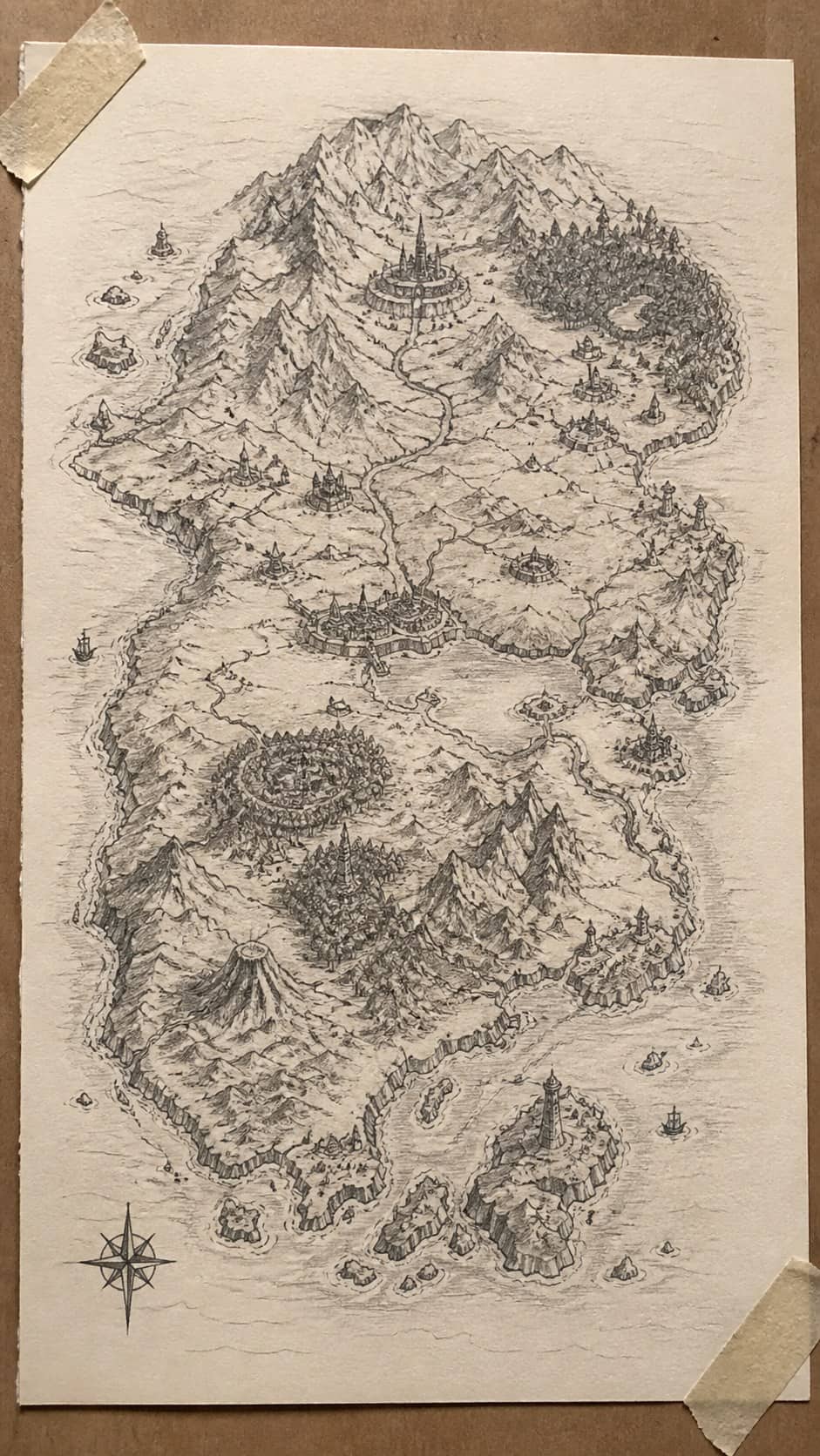 Bored with Your Sketchbook? 20 Drawing Ideas to Revive Your Creativity 27 Hand-drawn fantasy maps in graphite drawing on textured paper, shown in a close overhead crop — study 2