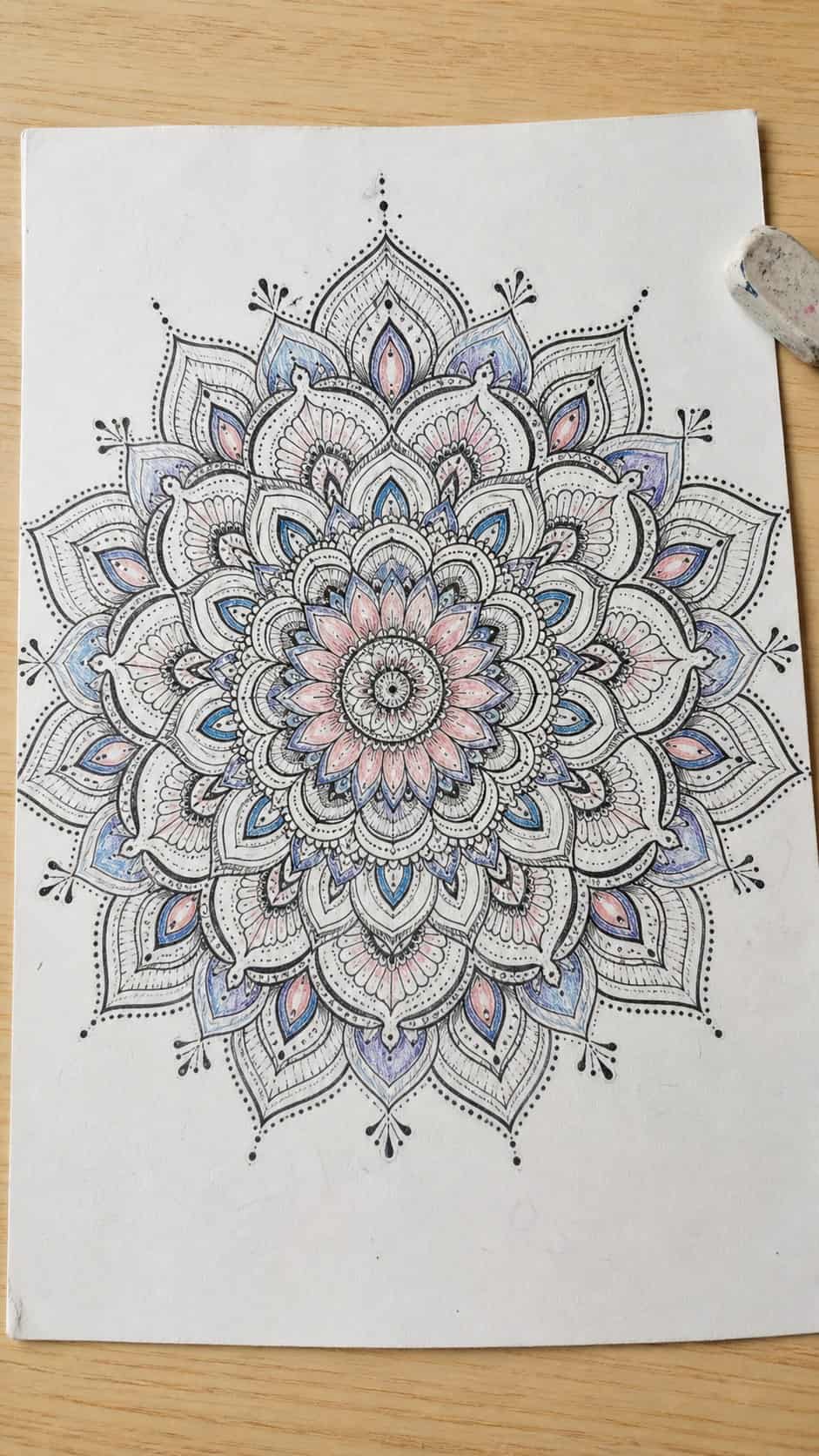 Unlocking the Artist Within: 21 Must-Try Doodle Drawing Ideas 4 Hand-drawn intricate mandalas in ink and colored-pencil drawing on textured paper, shown in a straight overhead view — study 1