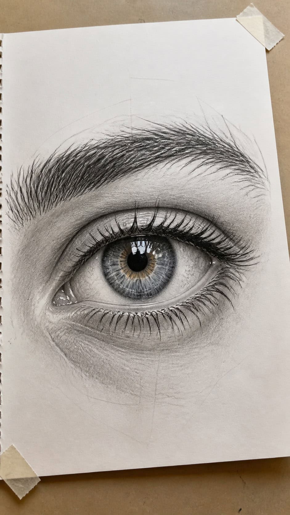 20 Challenging Drawing Ideas to Push Your Artistic Limits 5 Hand-drawn hyper-realistic eye in mixed-media hand drawing on textured paper, shown in a slightly off-center overhead composition — study 2