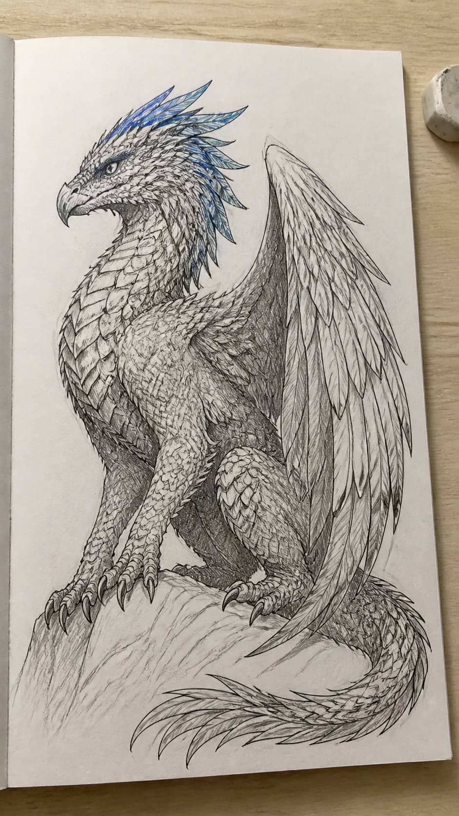 20 Challenging Drawing Ideas to Push Your Artistic Limits 13 Hand-drawn fantasy creature with scales and feathers in mixed-media hand drawing on textured paper, shown in a slightly off-center — study 1