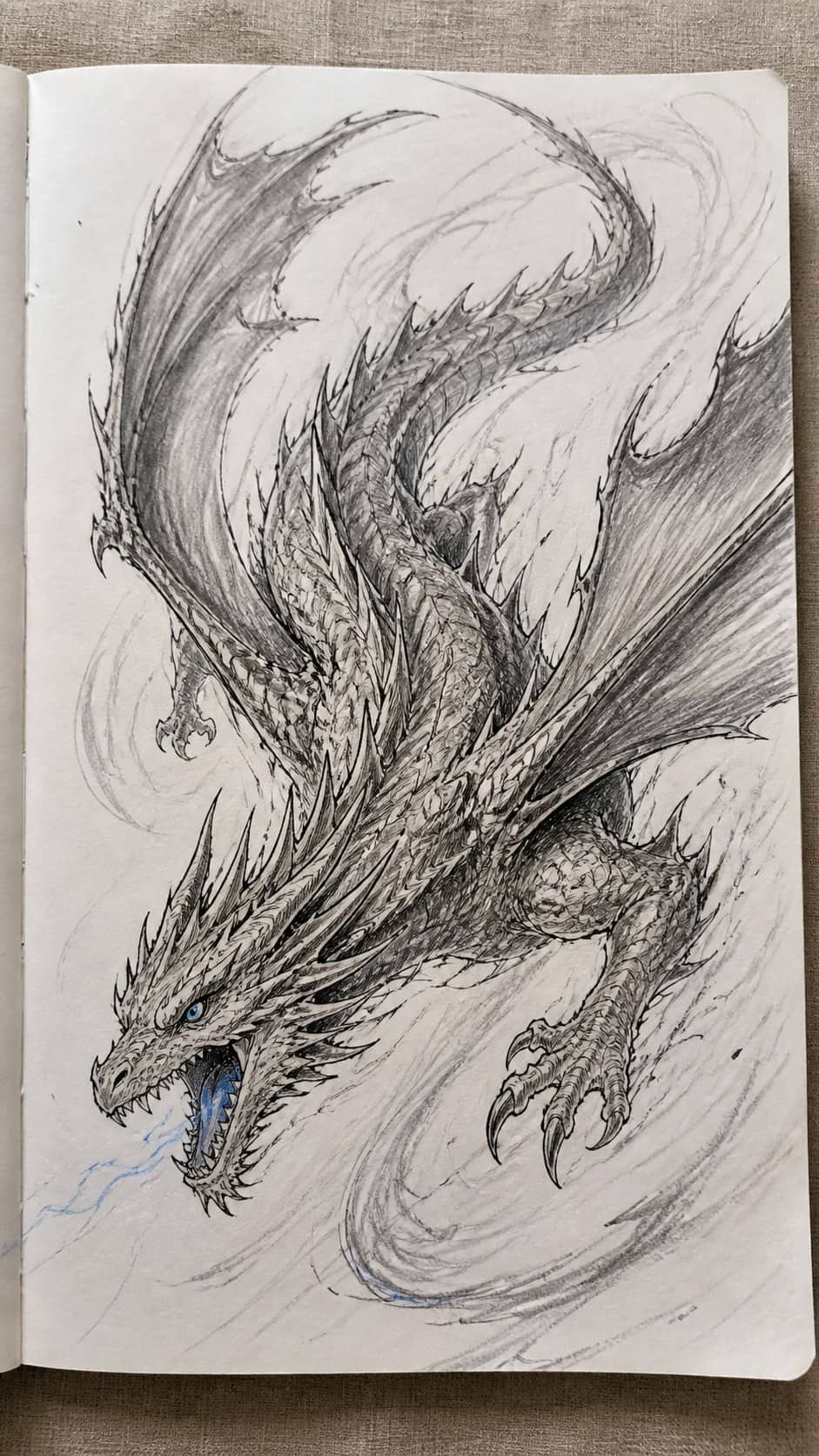 20 Challenging Drawing Ideas to Push Your Artistic Limits 24 Hand-drawn dragon in motion in mixed-media hand drawing on textured paper, shown in a close overhead crop — study 1