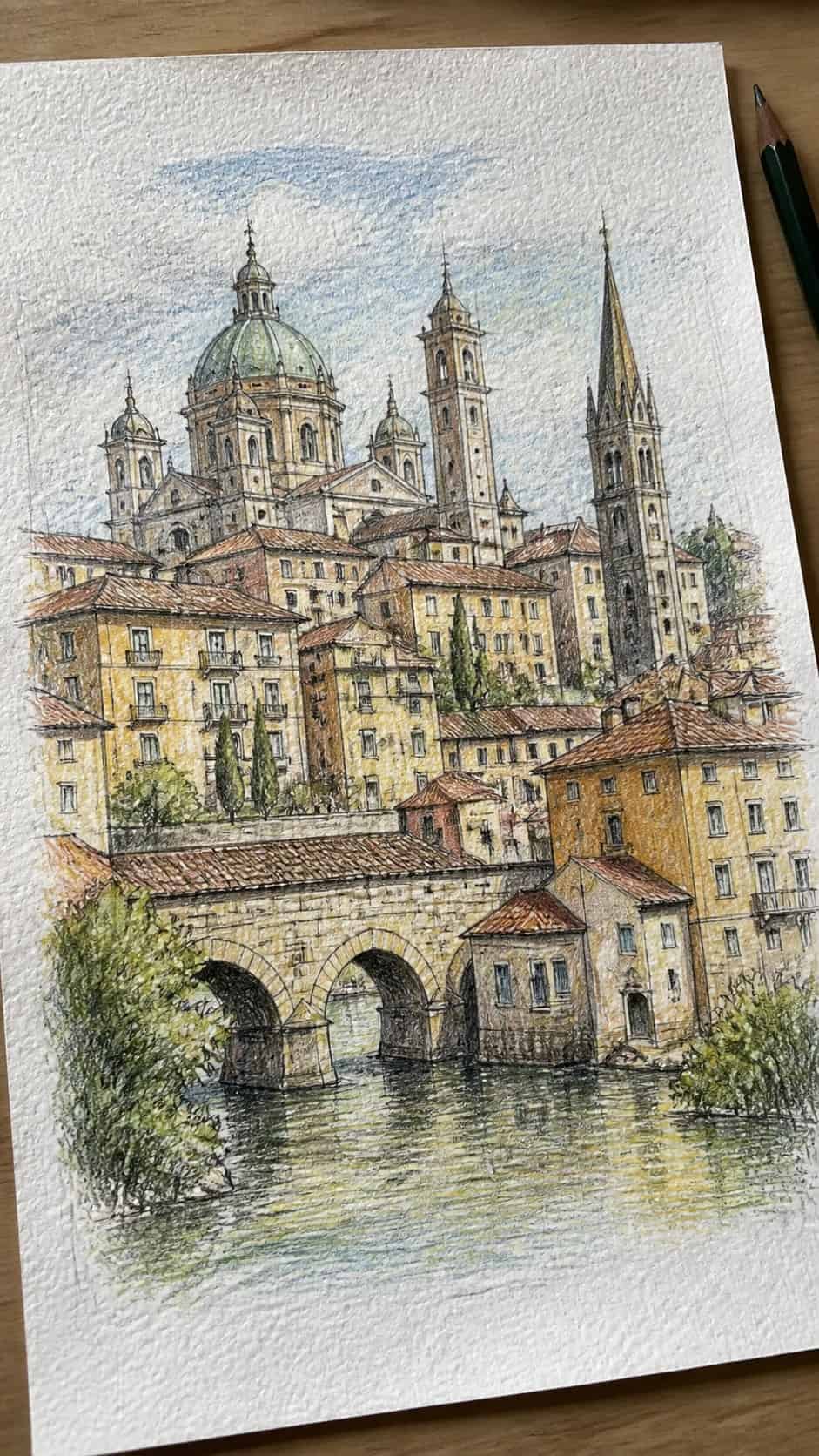 20 Challenging Drawing Ideas to Push Your Artistic Limits 36 Hand-drawn architectural landscape with multiple buildings in colored-pencil and gouache drawing on textured paper, shown in a gentle — study 2