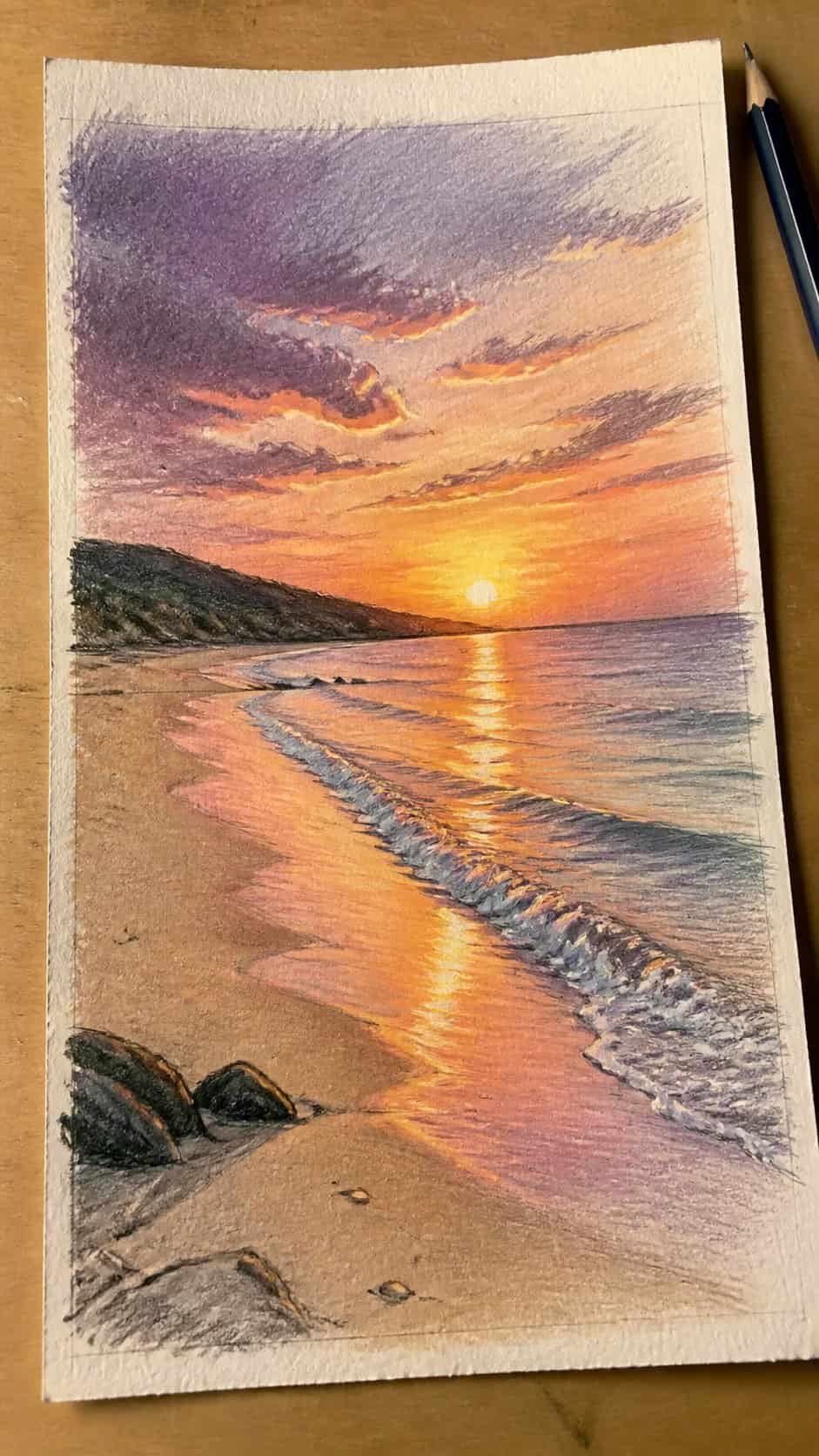 15 Landscape Drawing Ideas Worth Trying 4 Hand-drawn tranquil beach at sunset in colored-pencil and gouache drawing on textured paper, shown in a slightly off-center overhead — study 1