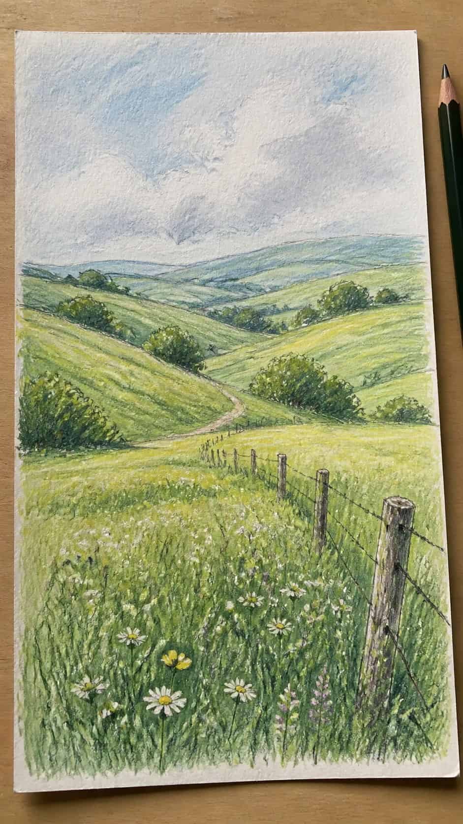 15 Landscape Drawing Ideas Worth Trying 9 Hand-drawn rolling hills and meadows in colored-pencil and gouache drawing on textured paper, shown in a straight overhead view — study 1