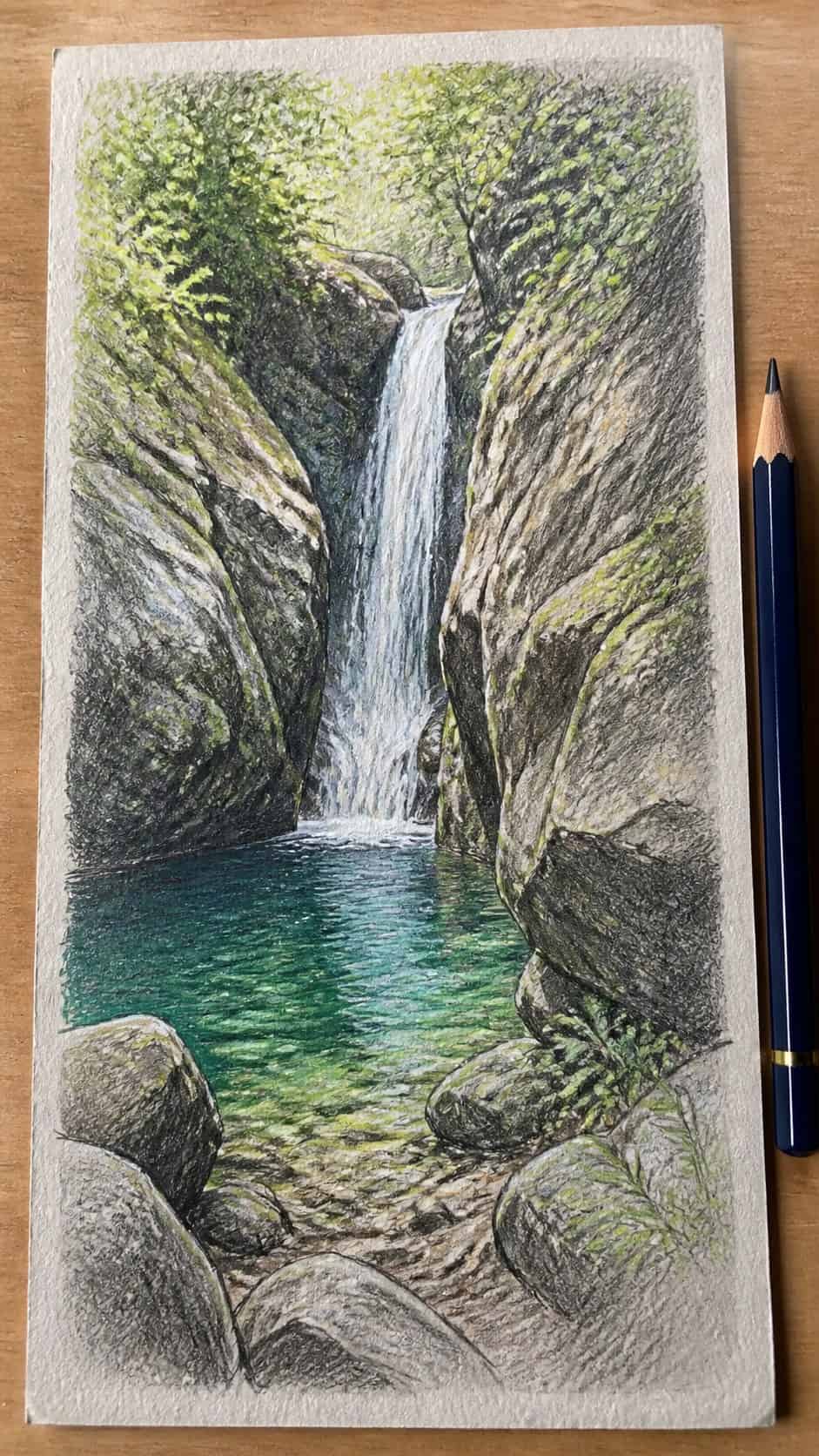 15 Landscape Drawing Ideas Worth Trying 14 Hand-drawn hidden waterfall in colored-pencil and gouache drawing on textured paper, shown in a close overhead crop — study 1
