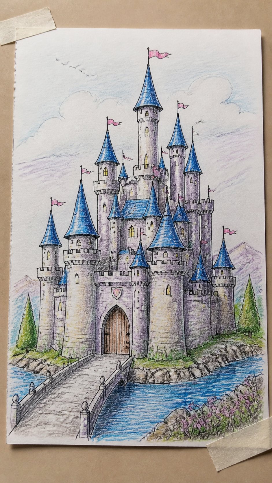 Discover the 15 Drawing Ideas Guaranteed to Unlock Your Child's Inner Picasso 24 Hand-drawn fairytale castle in colored-pencil drawing on textured paper, shown in a close overhead crop — study 1