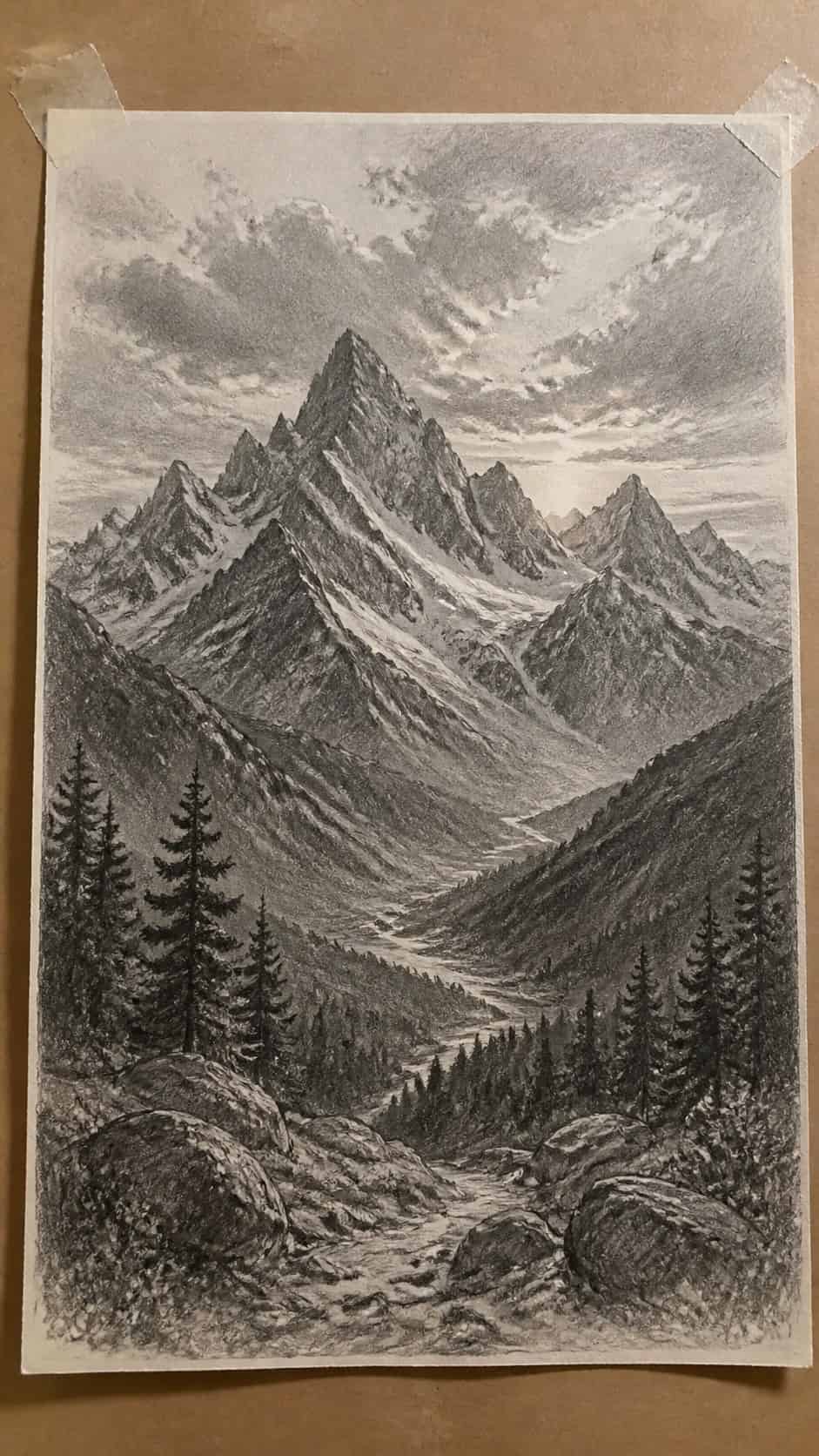 17 Nature Drawing Concepts to Inspire Your Next Sketch 6 Hand-drawn majestic mountain range in graphite drawing on textured paper, shown in a close overhead crop — study 3