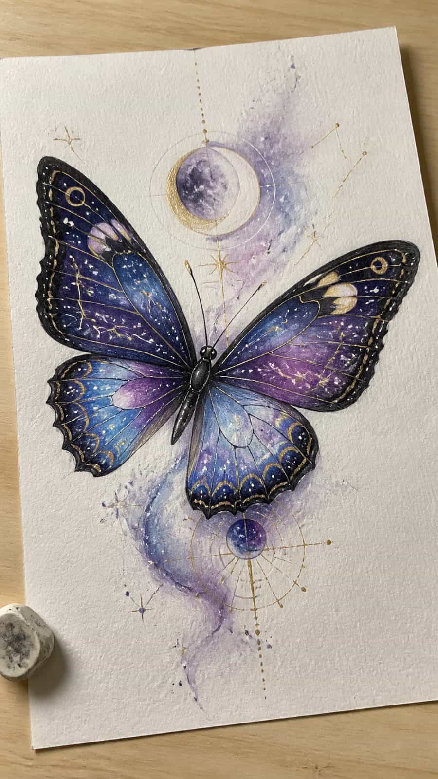 Bored of the Usual? Discover 16 Fresh Butterfly Drawing Concepts 20 Hand-drawn celestial butterfly in colored-pencil and gouache drawing on textured paper, shown in a slightly off-center overhead — study 2