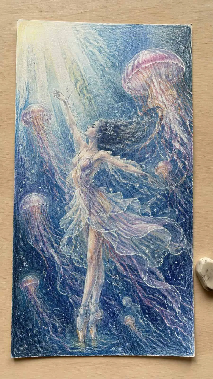 Hand-drawn mystical jellyfish ballet in colored-pencil and gouache drawing on textured paper, shown in a straight overhead view — study 2
