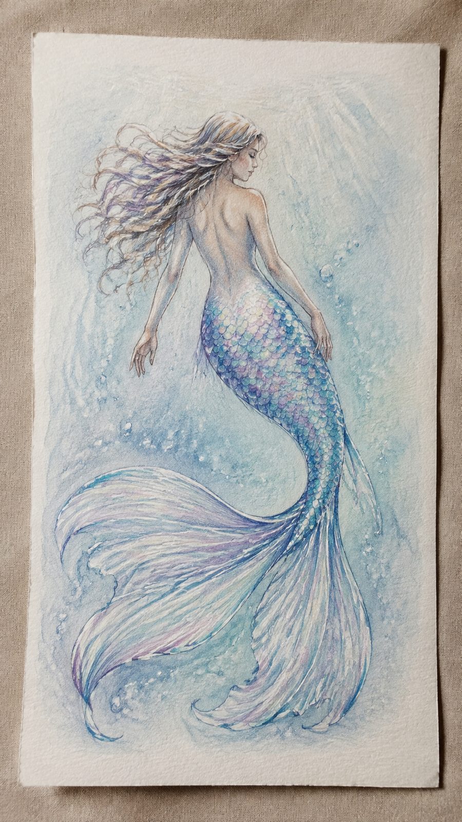 Hand-drawn glistening mermaid tale in colored-pencil and gouache drawing on textured paper, shown in a slightly off-center overhead — study 1